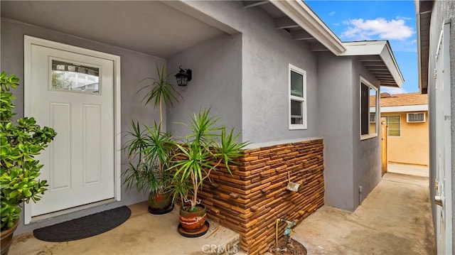 property entrance featuring stucco siding