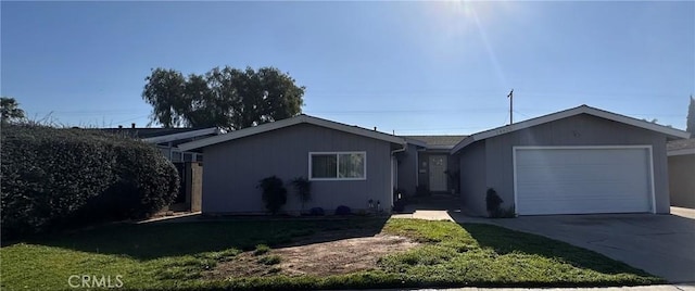 ranch-style house with a garage, a front yard, and driveway