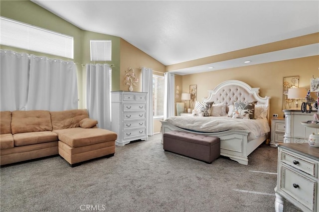 bedroom with carpet flooring and vaulted ceiling