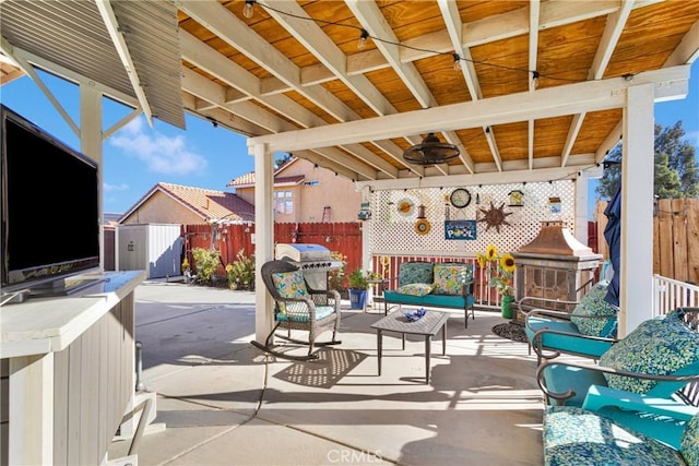 view of patio / terrace featuring an outdoor living space, ceiling fan, and a grill