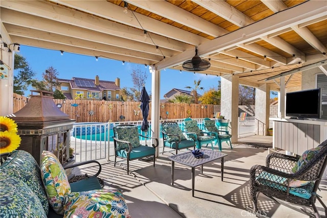 view of patio featuring a fenced in pool