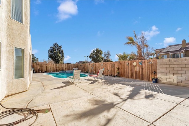 view of pool featuring a patio