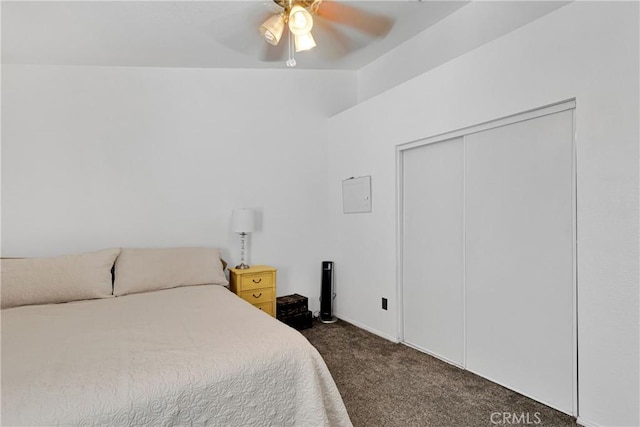 carpeted bedroom with a closet and ceiling fan