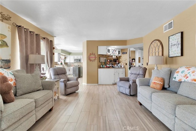 living room with light hardwood / wood-style flooring