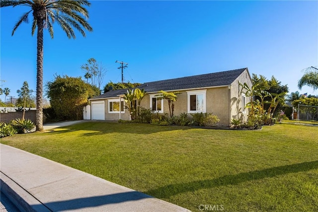 ranch-style house featuring a garage and a front lawn