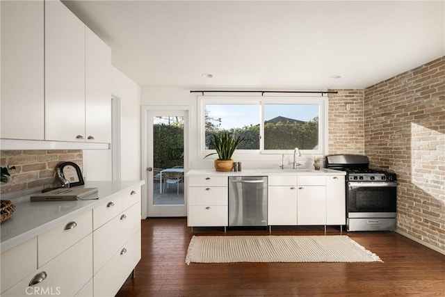 kitchen featuring white cabinets, dark hardwood / wood-style floors, sink, and appliances with stainless steel finishes