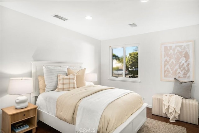 bedroom featuring dark hardwood / wood-style flooring and radiator