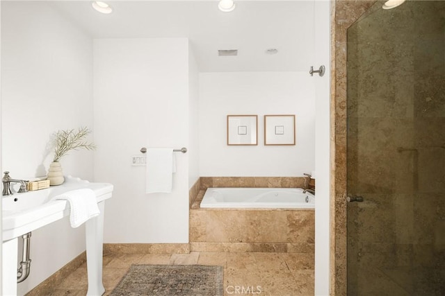 bathroom featuring tile patterned floors and plus walk in shower