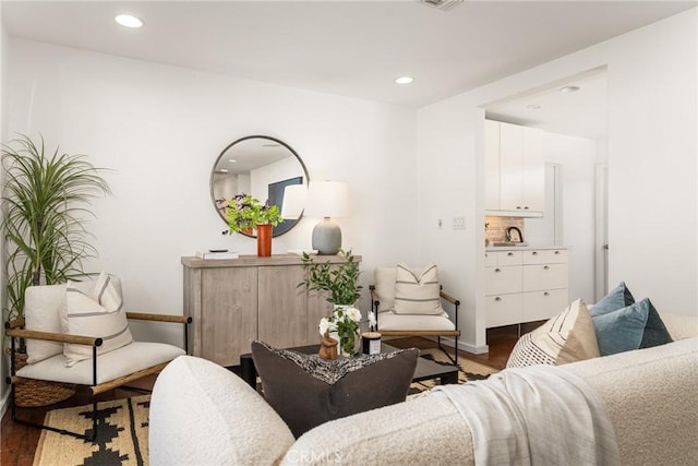 living area with hardwood / wood-style floors