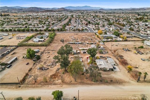 birds eye view of property featuring a mountain view