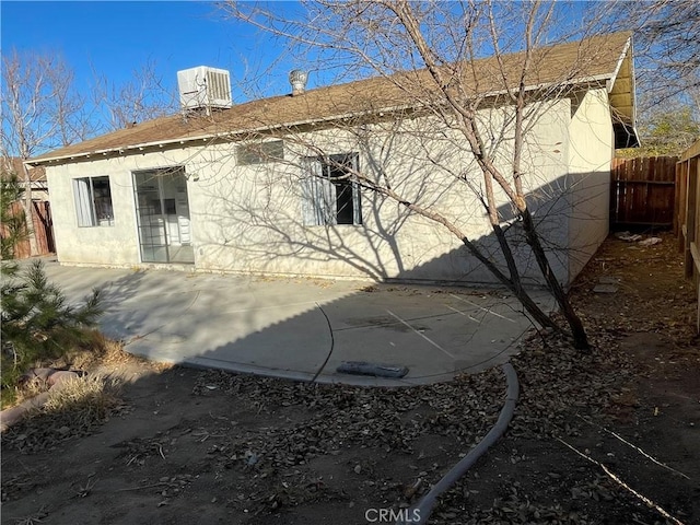 back of house featuring a patio area and central AC unit