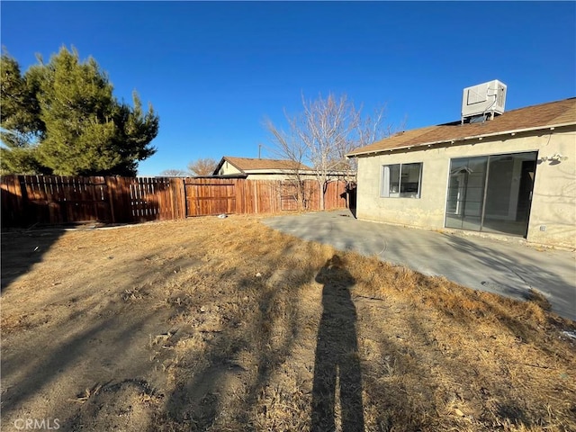 view of yard featuring a patio and cooling unit