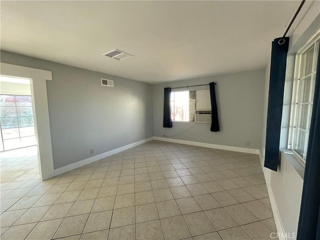 empty room featuring light tile patterned floors