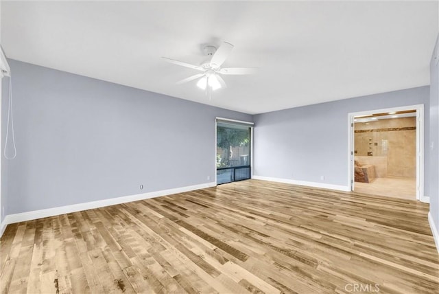 empty room with light hardwood / wood-style flooring and ceiling fan