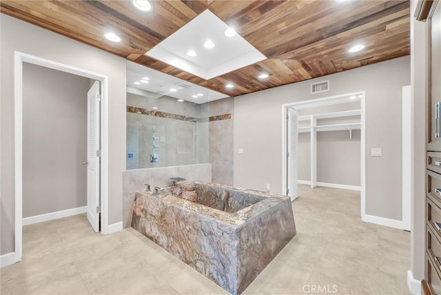 bathroom with walk in shower and wooden ceiling