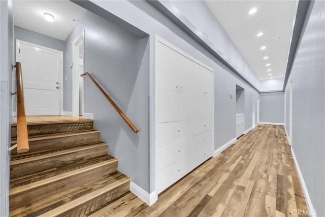 hall with light hardwood / wood-style flooring