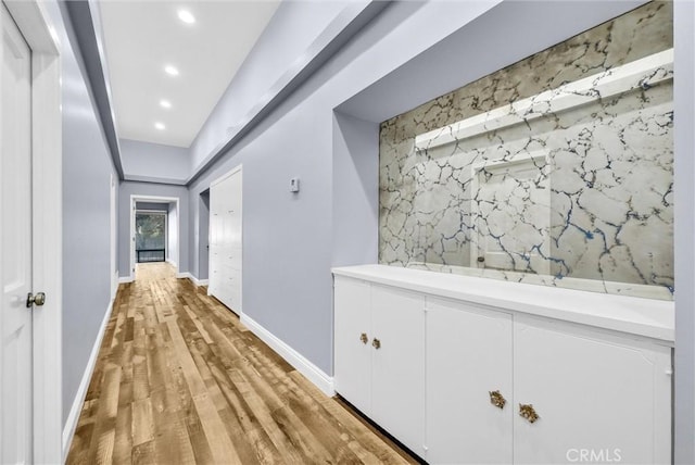 corridor featuring light hardwood / wood-style flooring