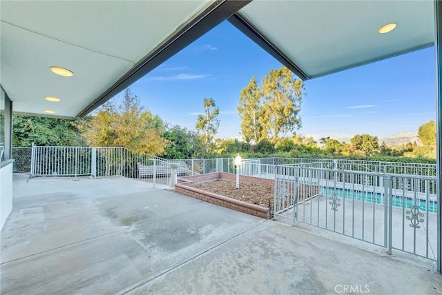 view of patio featuring a fenced in pool