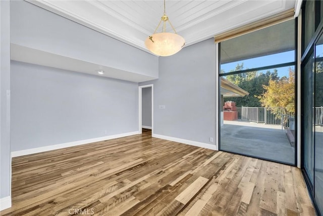 unfurnished room with wood-type flooring and crown molding