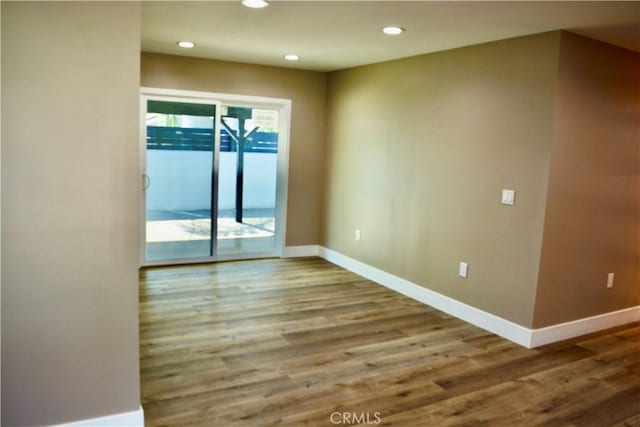 spare room featuring hardwood / wood-style flooring