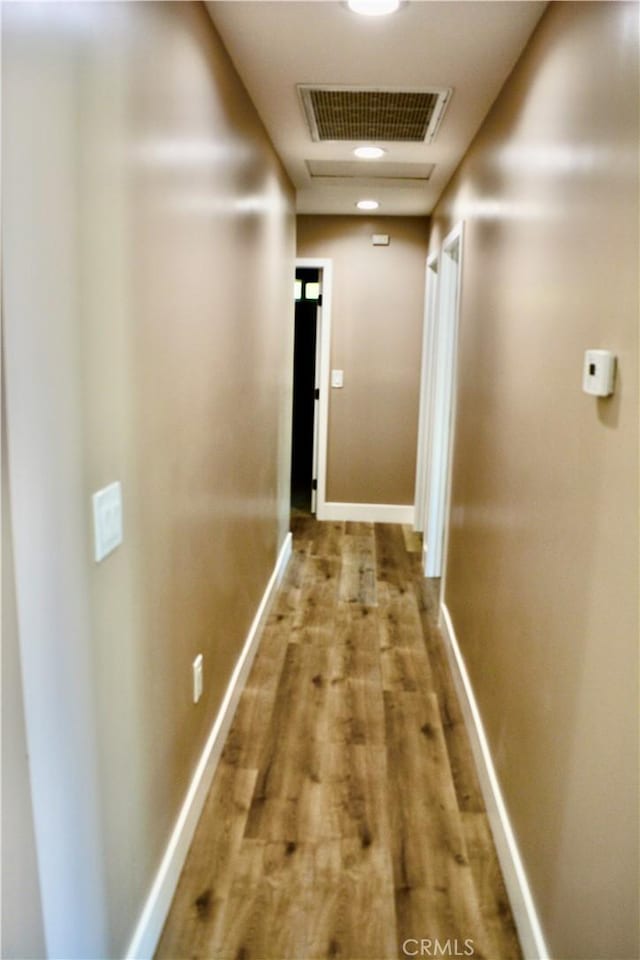 hall with light wood-type flooring