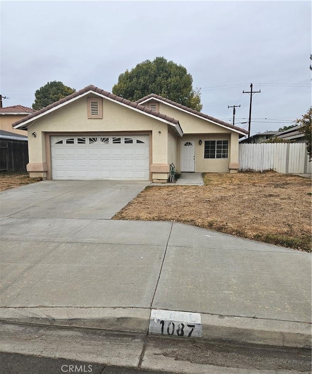 single story home featuring a garage