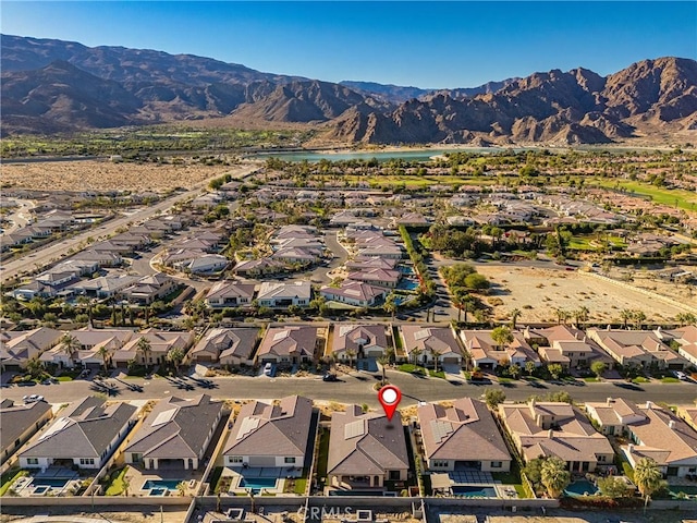 drone / aerial view with a residential view and a mountain view