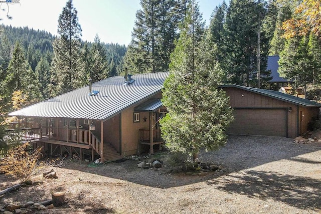 exterior space with a garage and an outdoor structure