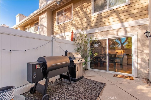 view of patio featuring a grill