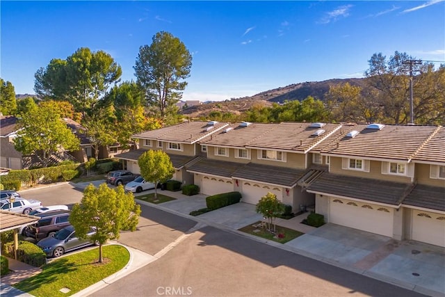 birds eye view of property featuring a mountain view