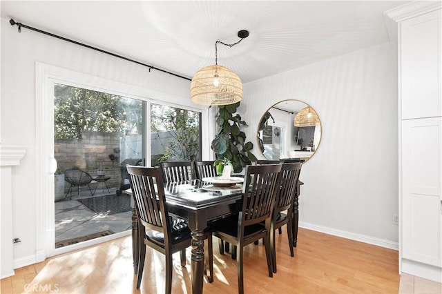 dining area with light hardwood / wood-style flooring