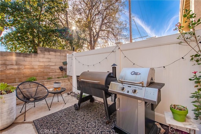 view of patio featuring a grill