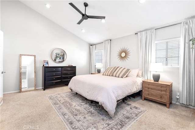 bedroom featuring light carpet, multiple windows, and ceiling fan