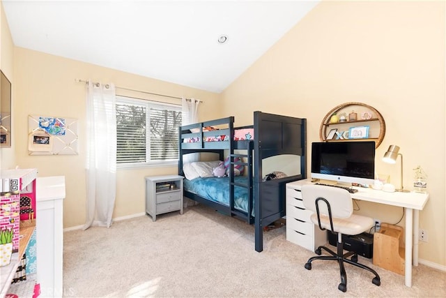 carpeted bedroom with high vaulted ceiling