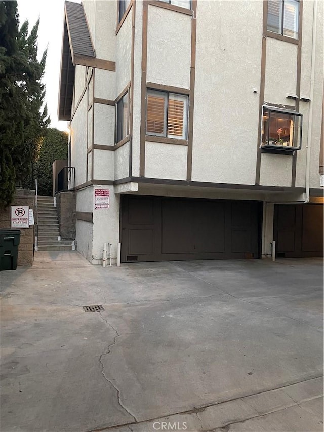 view of side of property featuring a garage