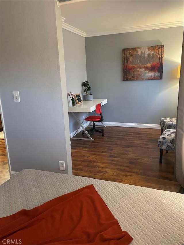 bedroom with hardwood / wood-style floors and crown molding