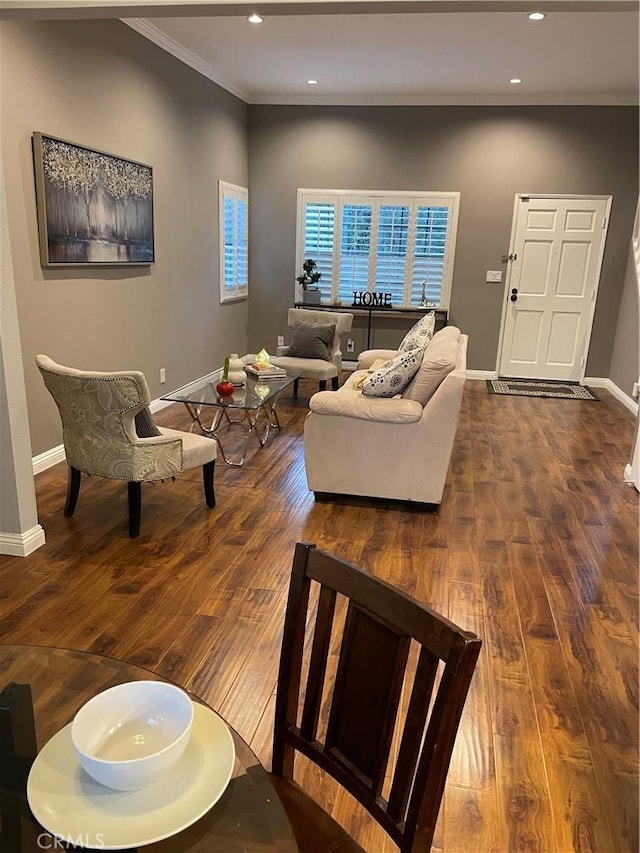 living room with dark hardwood / wood-style floors and ornamental molding