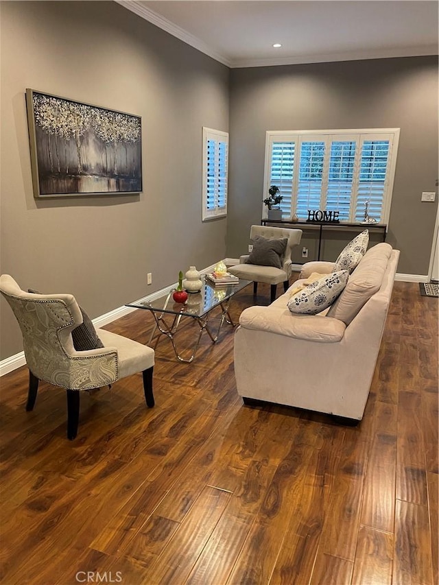 living room featuring dark hardwood / wood-style flooring and ornamental molding