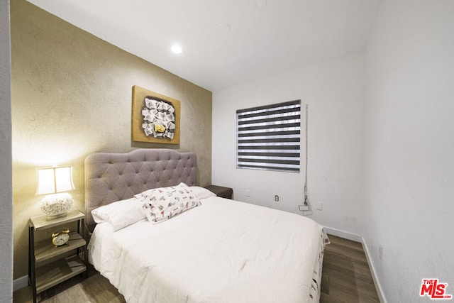 bedroom featuring dark hardwood / wood-style floors