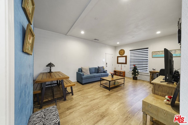 living room with light hardwood / wood-style flooring