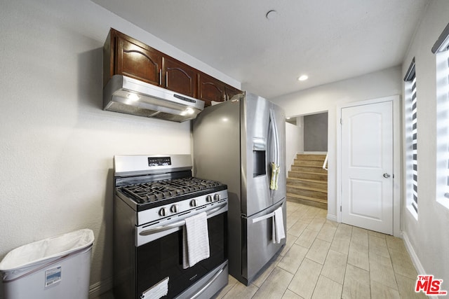 kitchen with appliances with stainless steel finishes and dark brown cabinets