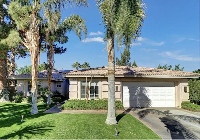 ranch-style home with a garage and a front lawn