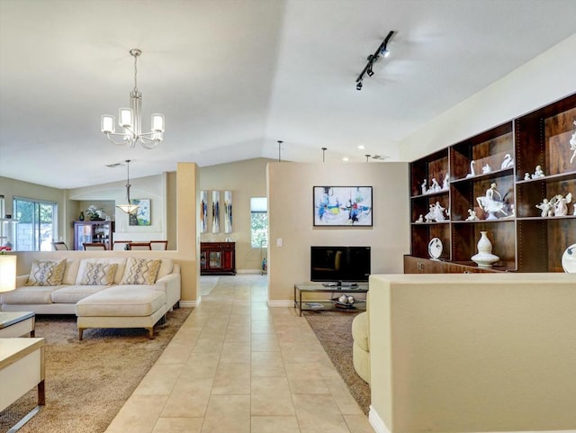 living room with lofted ceiling, light tile patterned floors, a wealth of natural light, and track lighting