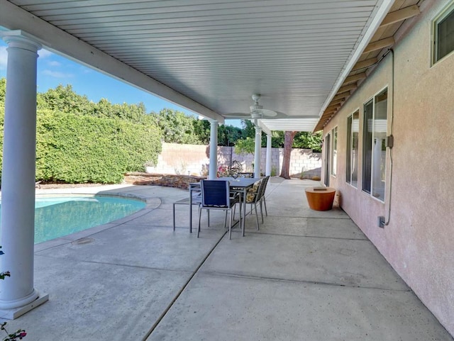 view of patio / terrace featuring a fenced in pool and ceiling fan