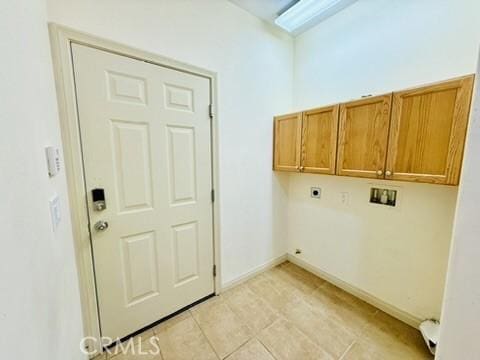 laundry area with hookup for a washing machine, light tile patterned floors, cabinets, and hookup for an electric dryer