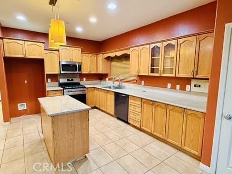 kitchen with appliances with stainless steel finishes, sink, light tile patterned floors, decorative light fixtures, and a kitchen island