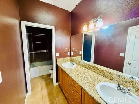 full bathroom with tile patterned floors, vanity, toilet, and shower / bathing tub combination