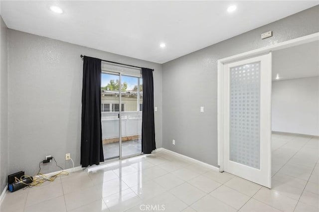 empty room featuring light tile patterned flooring