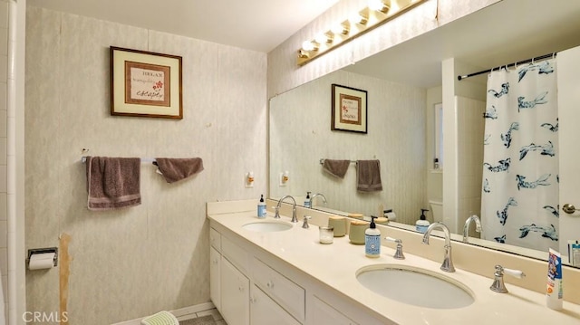 bathroom with vanity, a shower with shower curtain, and toilet