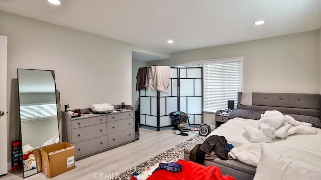 bedroom with light hardwood / wood-style floors